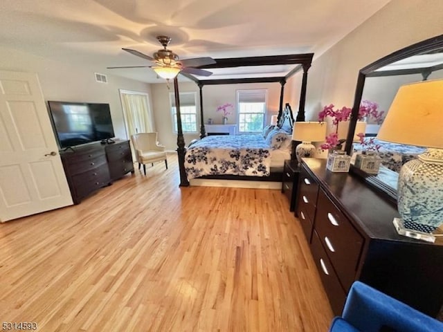 bedroom with light wood-type flooring and ceiling fan