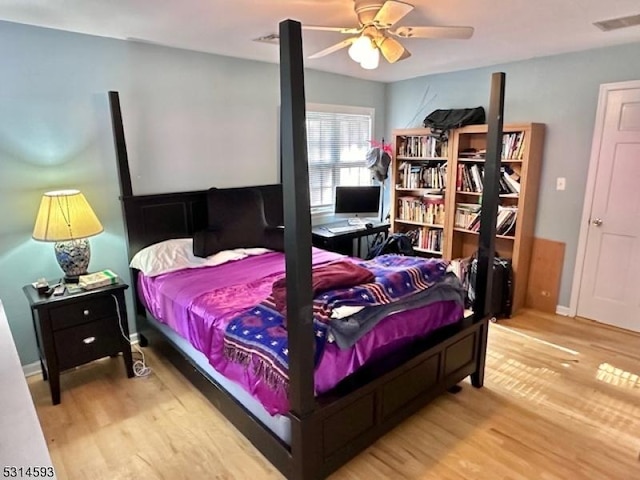 bedroom with ceiling fan and hardwood / wood-style floors