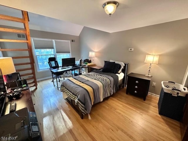 bedroom featuring wood-type flooring