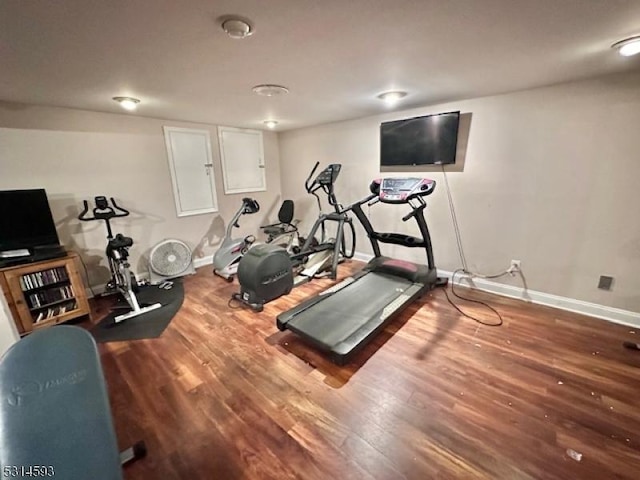 workout area featuring hardwood / wood-style floors