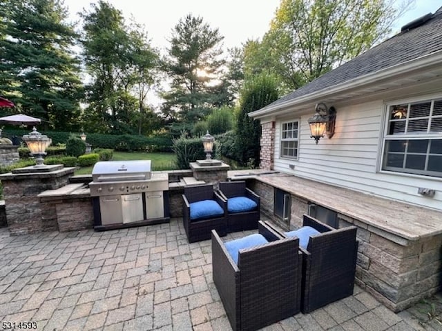 view of patio with grilling area and exterior kitchen