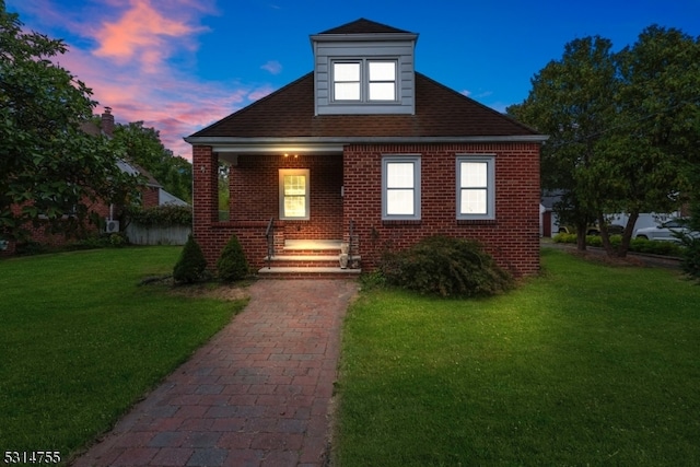 view of front of home featuring a yard