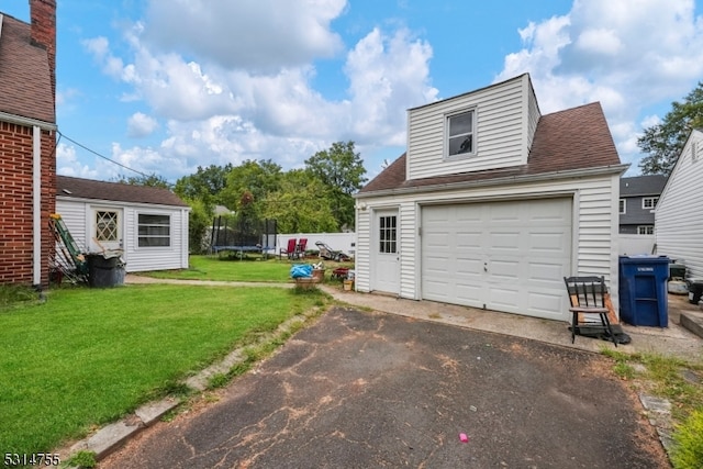 garage featuring a yard