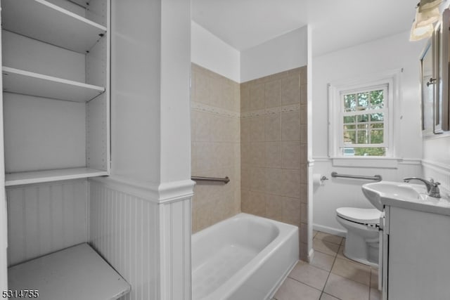 bathroom featuring vanity, toilet, and tile patterned floors