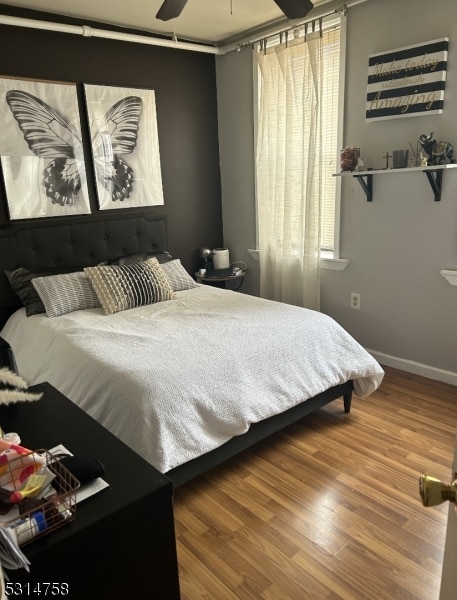 bedroom featuring ceiling fan and hardwood / wood-style floors