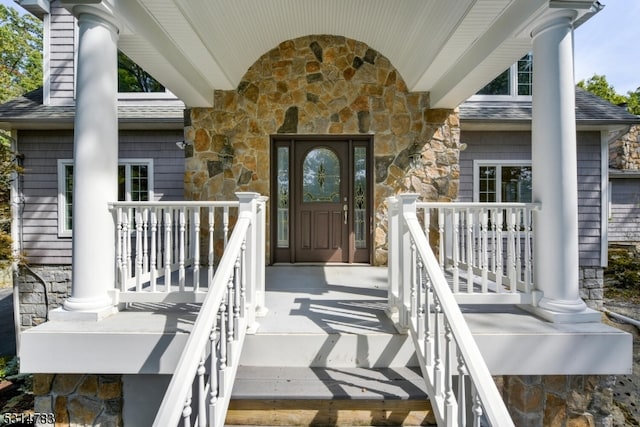 property entrance featuring covered porch