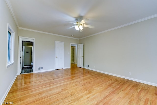 spare room with ornamental molding, light hardwood / wood-style floors, and ceiling fan