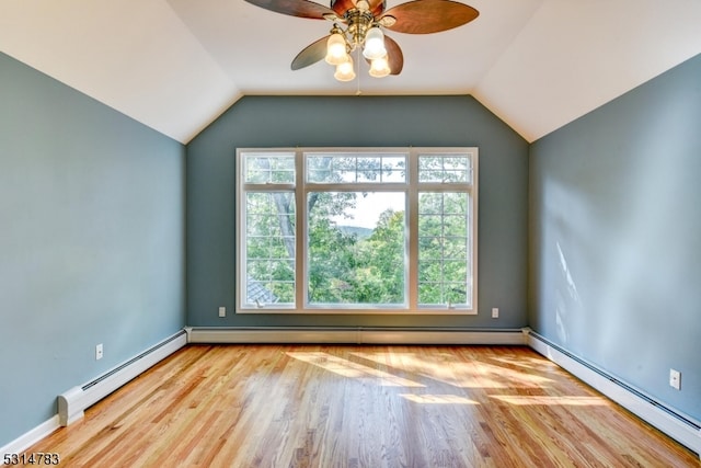 interior space with ceiling fan, light hardwood / wood-style flooring, a baseboard heating unit, and lofted ceiling