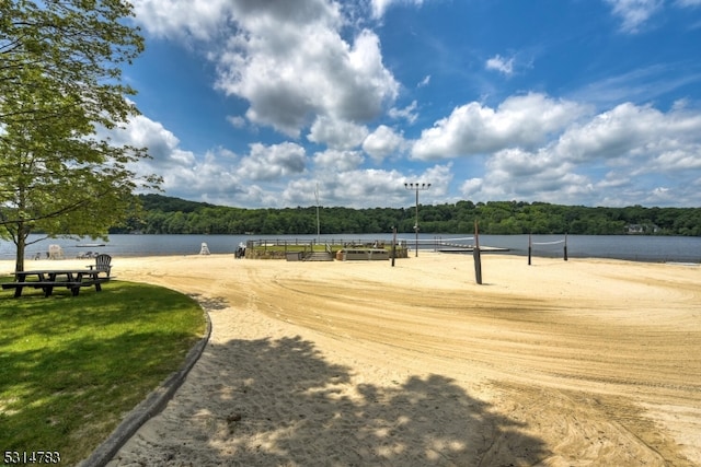 surrounding community with a water view