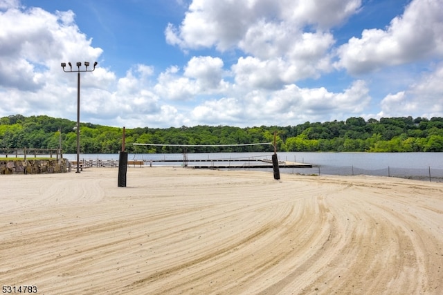 view of home's community featuring a water view and volleyball court