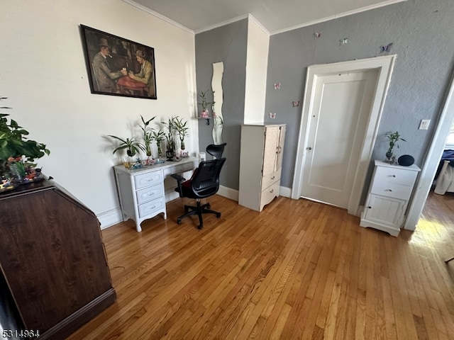 office featuring hardwood / wood-style flooring and crown molding