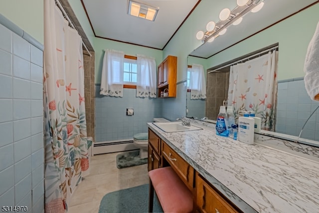 bathroom featuring vanity, tile patterned floors, a baseboard radiator, tile walls, and toilet