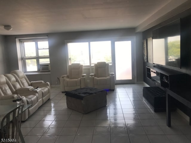 living room with cooling unit and tile patterned floors