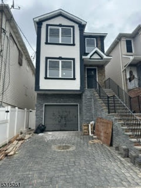 view of front of property featuring a garage