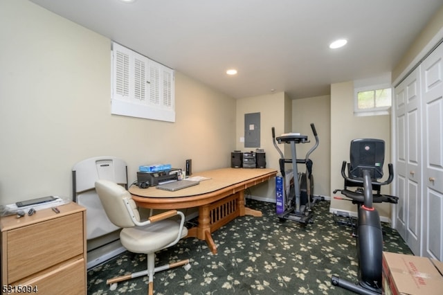 carpeted office featuring electric panel