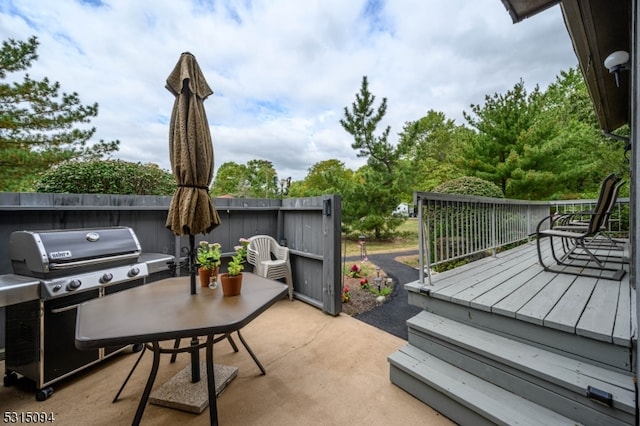 view of patio featuring area for grilling and a wooden deck