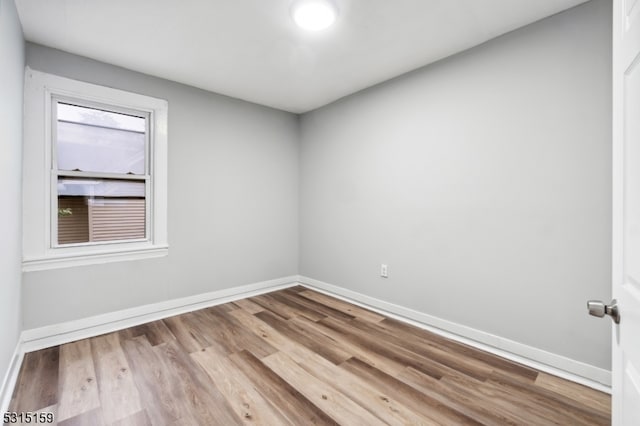 unfurnished room featuring light hardwood / wood-style flooring