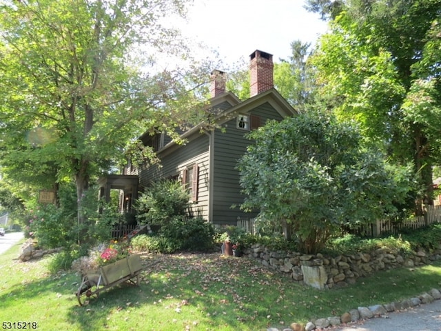 view of home's exterior with a lawn