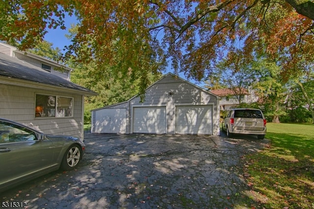 garage with a lawn