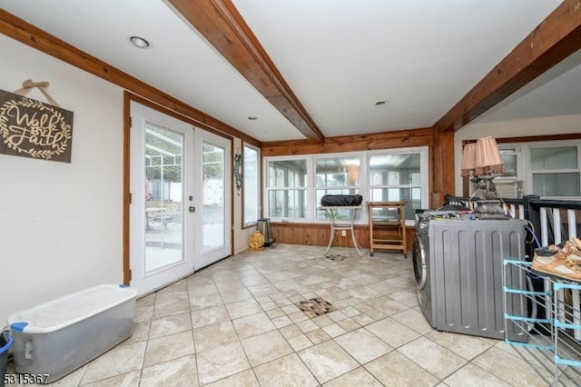 kitchen featuring beam ceiling, light tile patterned floors, and french doors