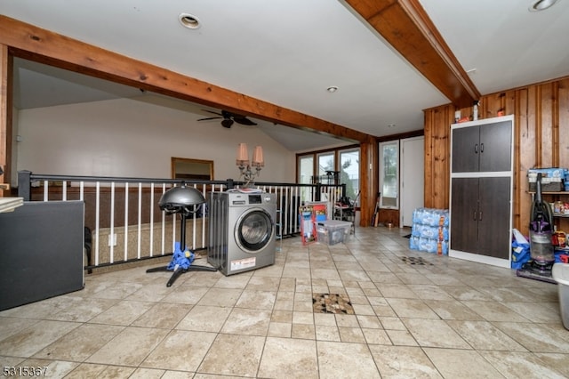 laundry room with wood walls