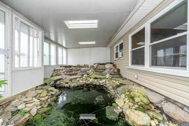 sunroom featuring a skylight