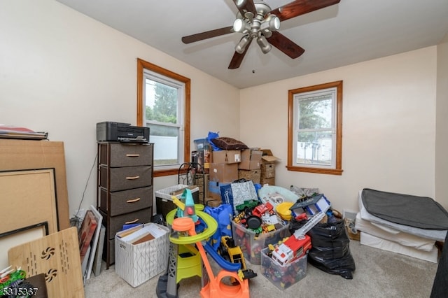 storage area featuring ceiling fan