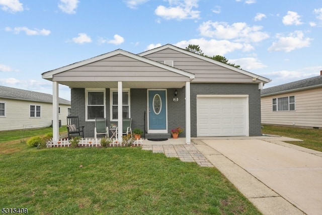 view of front facade with a garage, covered porch, and a front yard