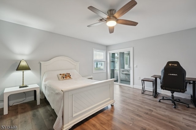 bedroom featuring ceiling fan and dark wood-type flooring