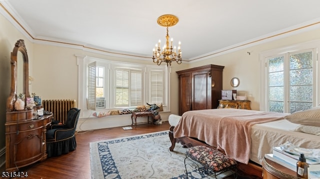 bedroom with dark wood-type flooring, ornamental molding, and multiple windows