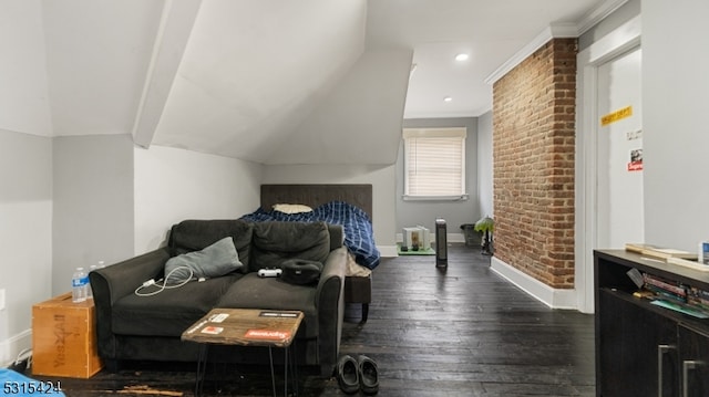 bedroom with crown molding, brick wall, lofted ceiling, and dark hardwood / wood-style flooring