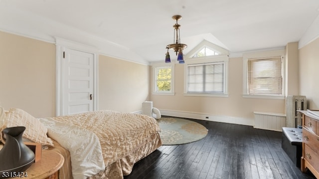 bedroom featuring dark wood-type flooring, lofted ceiling, and radiator