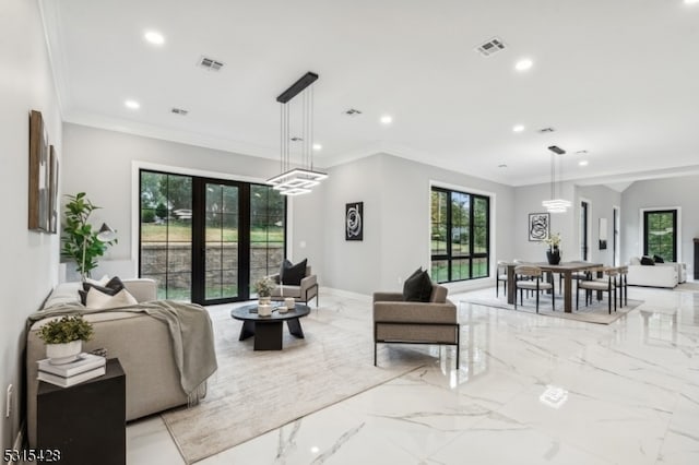 living room featuring french doors and crown molding