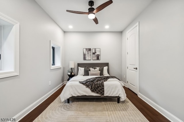 bedroom featuring ceiling fan and dark hardwood / wood-style flooring