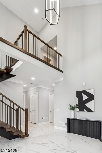 staircase with a high ceiling