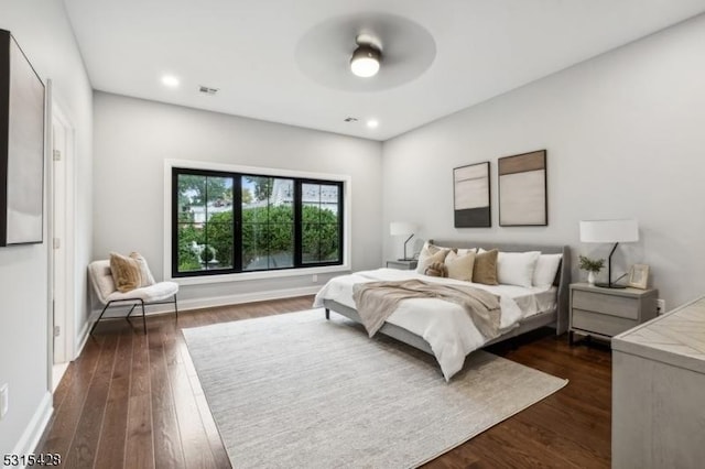 bedroom with visible vents, baseboards, a ceiling fan, dark wood finished floors, and recessed lighting