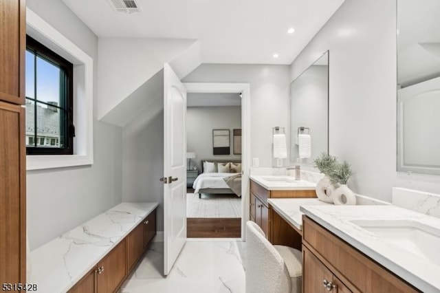 bathroom featuring two vanities, connected bathroom, visible vents, marble finish floor, and a sink