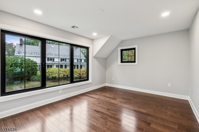 bonus room featuring dark hardwood / wood-style flooring