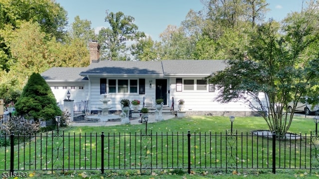 single story home with a front yard