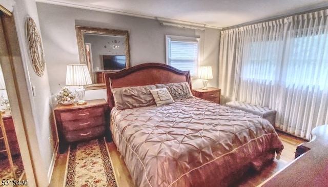 bedroom with ornamental molding