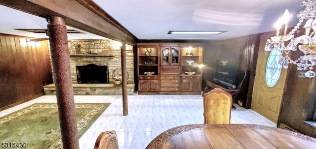 interior space with ornamental molding and a fireplace