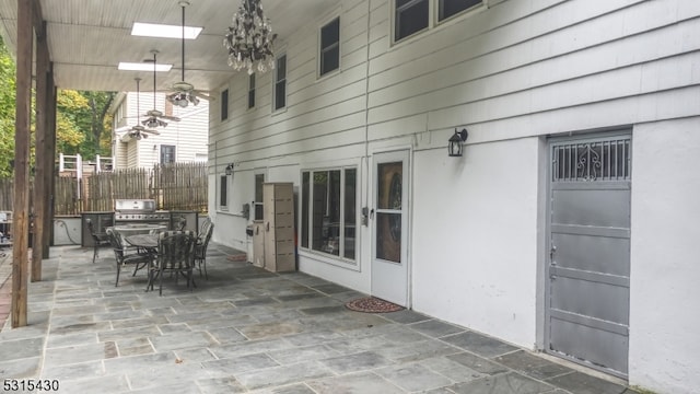 view of patio / terrace with ceiling fan and grilling area