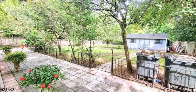 view of patio featuring an outbuilding