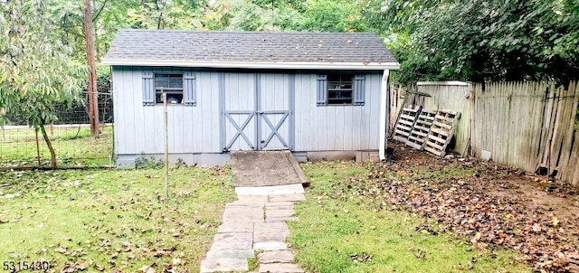 view of outdoor structure with a yard