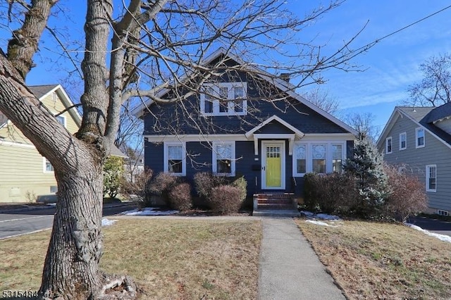 bungalow with a front yard