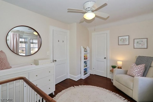 bedroom featuring ceiling fan, dark wood finished floors, and baseboards