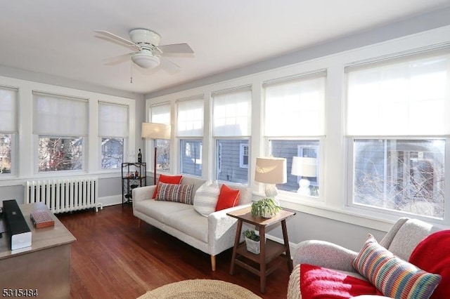 sunroom featuring ceiling fan and radiator heating unit