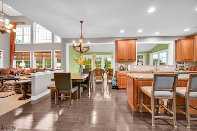 kitchen featuring an inviting chandelier, decorative light fixtures, and plenty of natural light