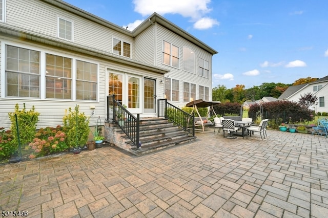 rear view of property with a patio area