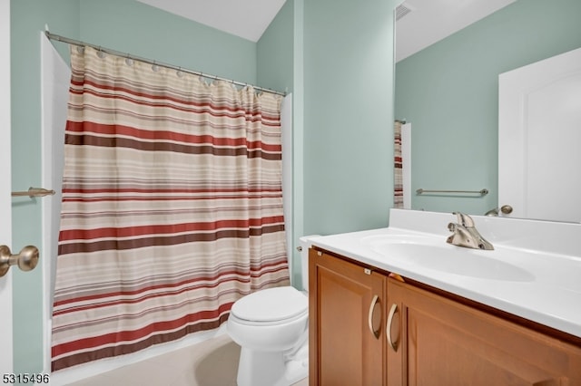 bathroom with vanity, toilet, tile patterned floors, and curtained shower